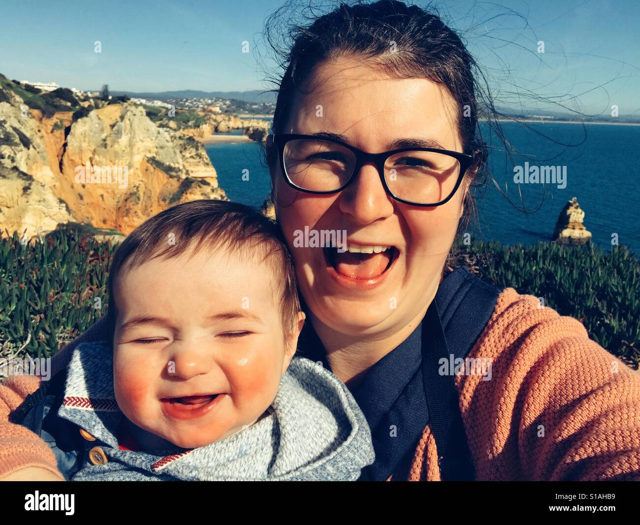 Happy mother and baby on holiday Ponta da Piedade Lagos Algarve Portugal Stock Photo