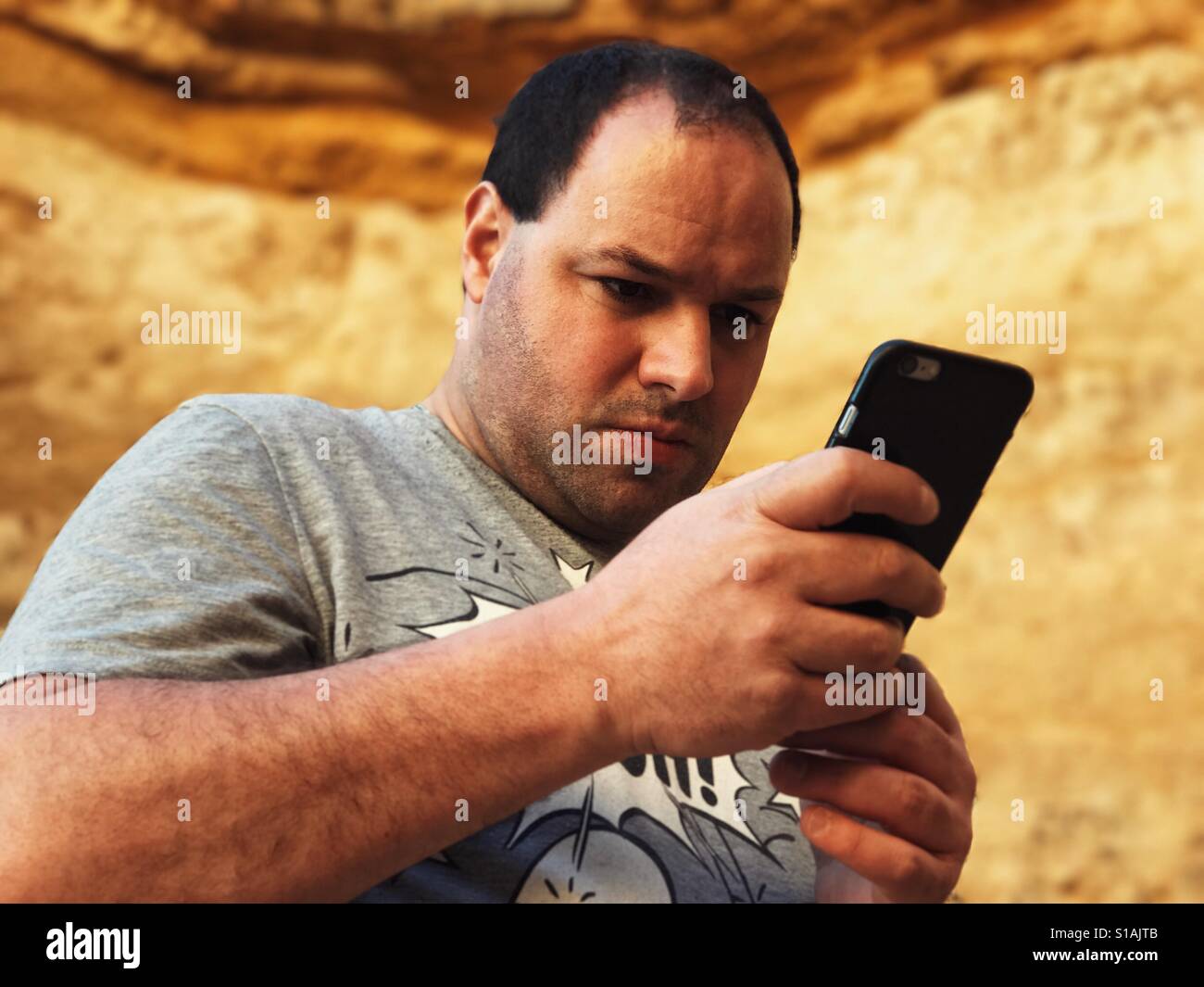 Man text messaging - Smartphone Captured Stock Image
