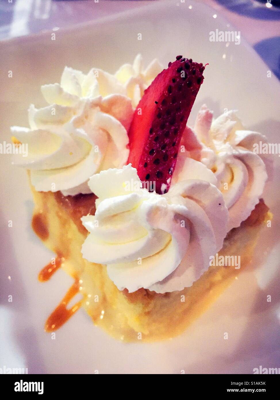 Tres Leches desert, traditional Mexican sponge cake with  cajeta sauce served at upscale luxury restaurant, NYC, USA - Smartphone Captured Stock Image