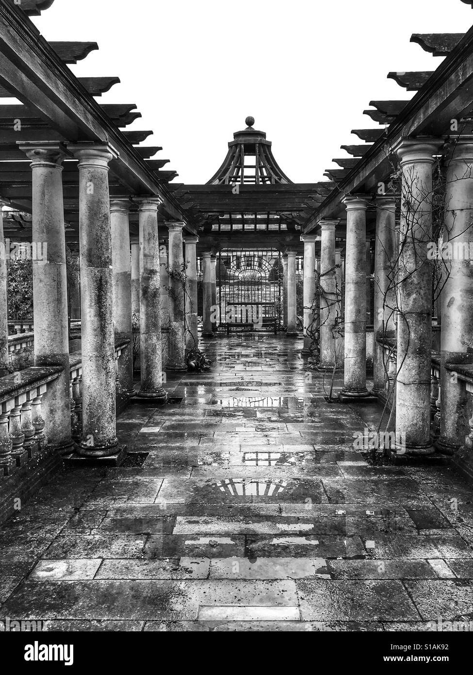 Black and white photo of the Pergola in the Hill Garden on a rainy afternoon at West Heath, Hampstead Heath, London, England, UK. Stock Photo