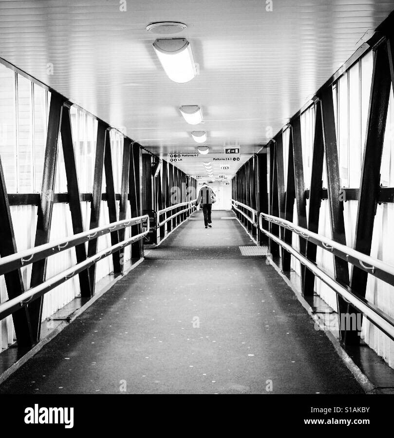 Person walking over a bridge. - Smartphone Captured Stock Image