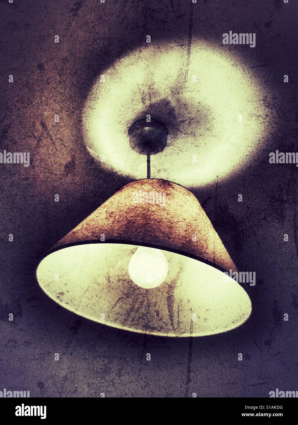 Ceiling light. Electric lightbulb with a crooked shade. - Smartphone Captured Stock Image