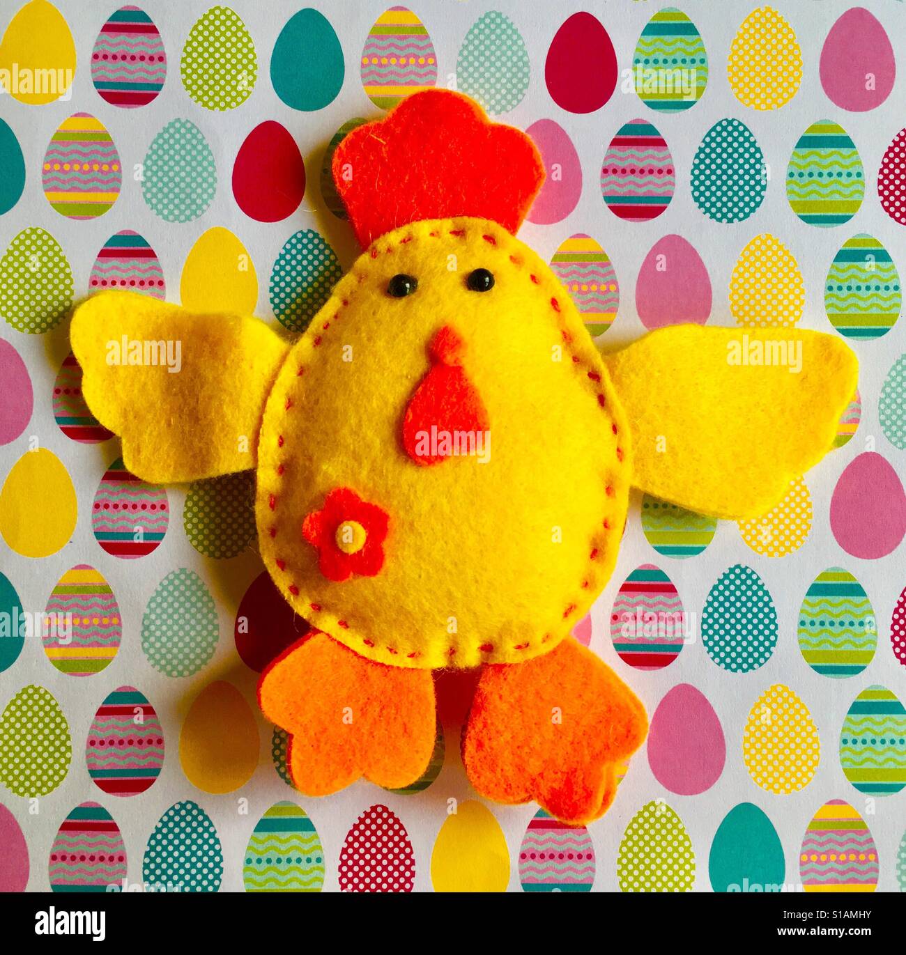 Homemade Easter Chick on Egg Background - Smartphone Captured Stock Image Homemade Easter Chick on Egg Background - Smartphone Captured Stock Image