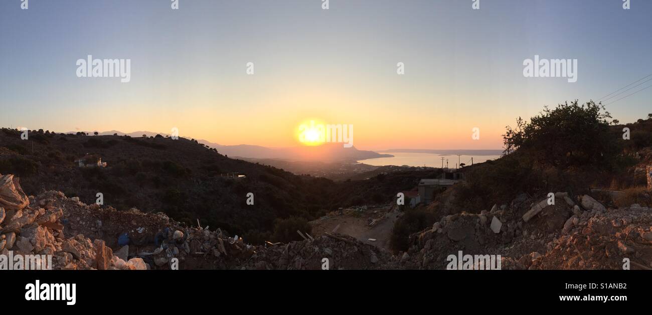 Sunset over a rubbish tip in Greece Stock Photo