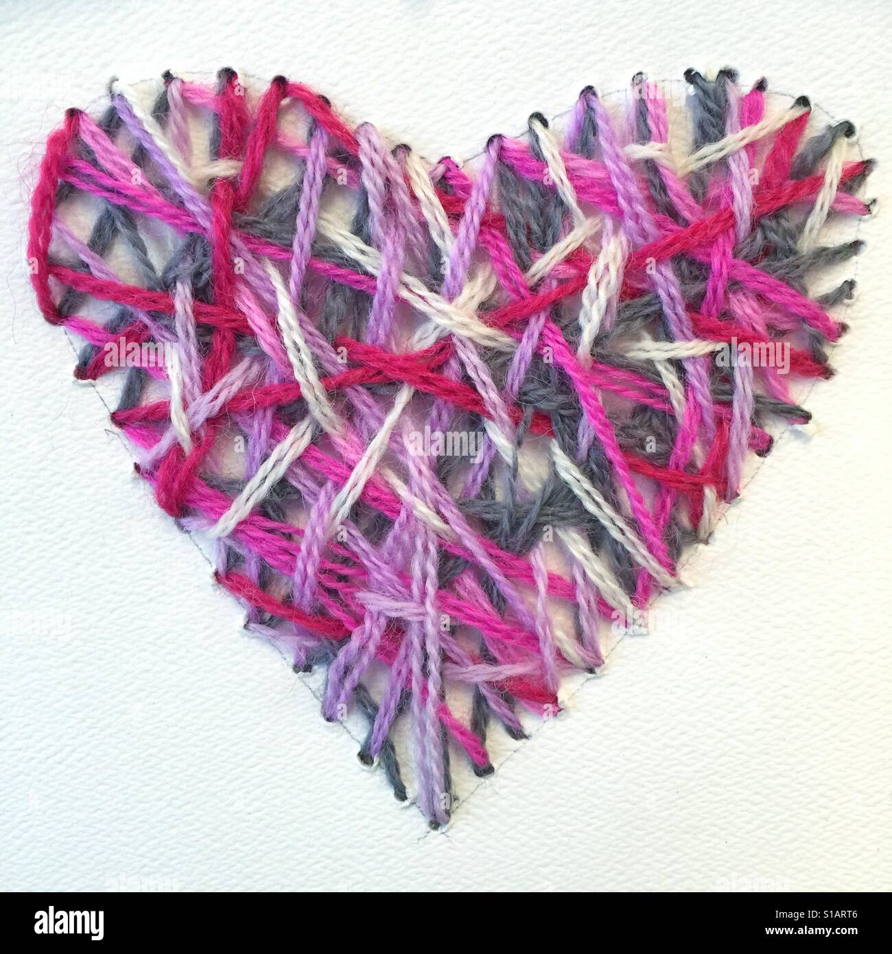 Heart shape embroidered on paper - Smartphone Captured Stock Image