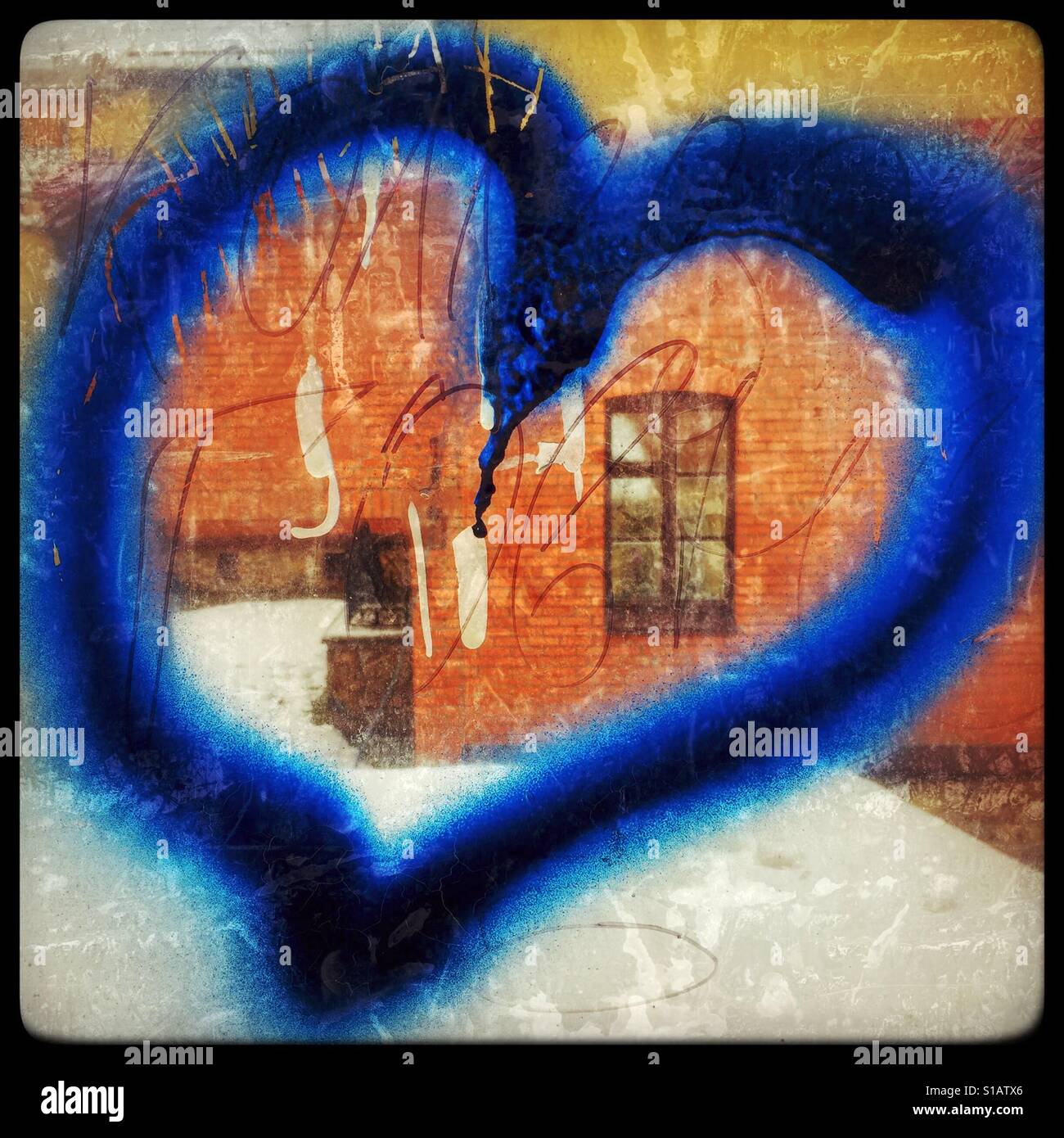 Blue heart graffiti on the window Stock Photo