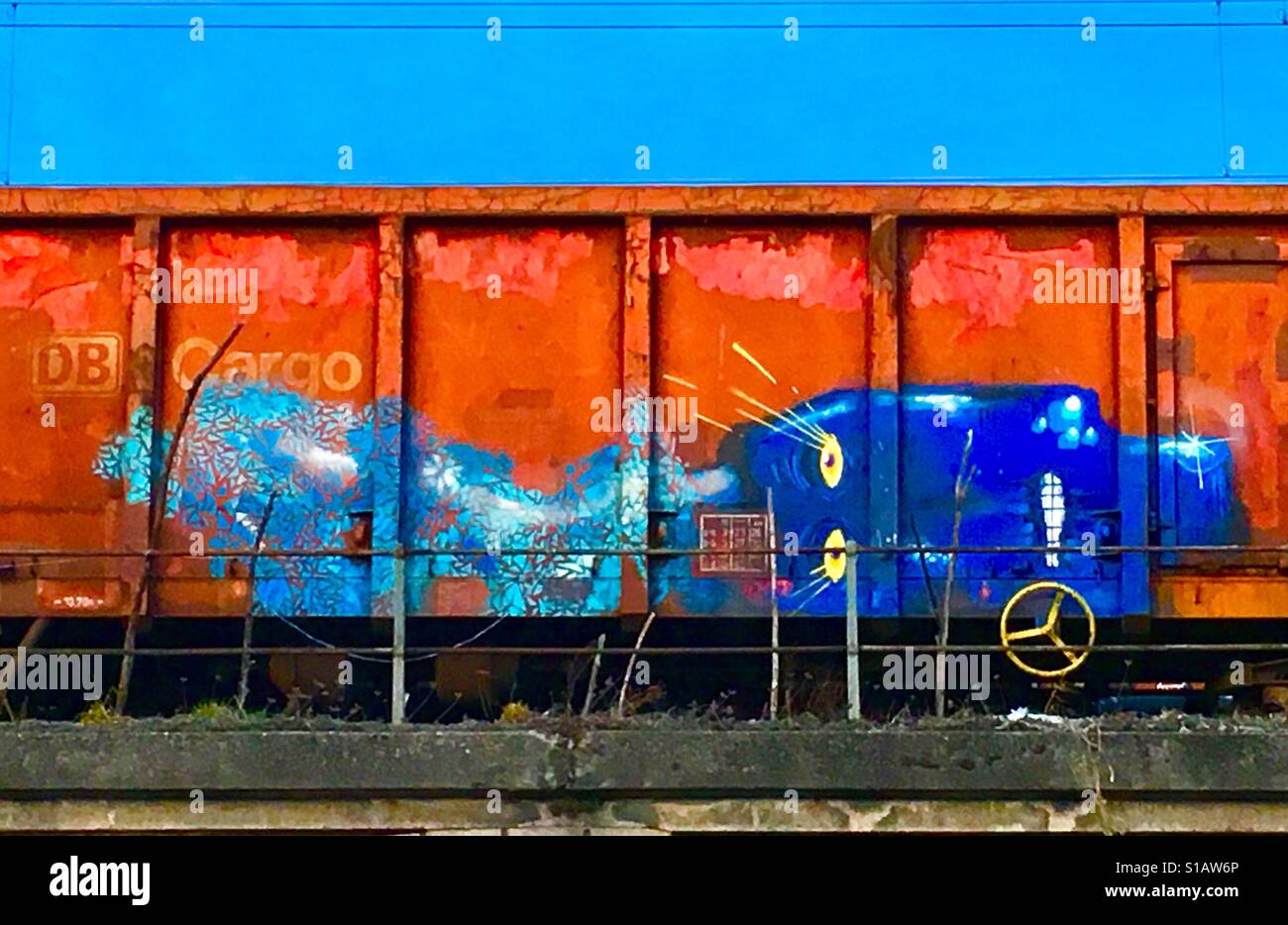 Old German Cargo Train With Robot Face Street Art. Munich - Smartphone Captured Stock Image
