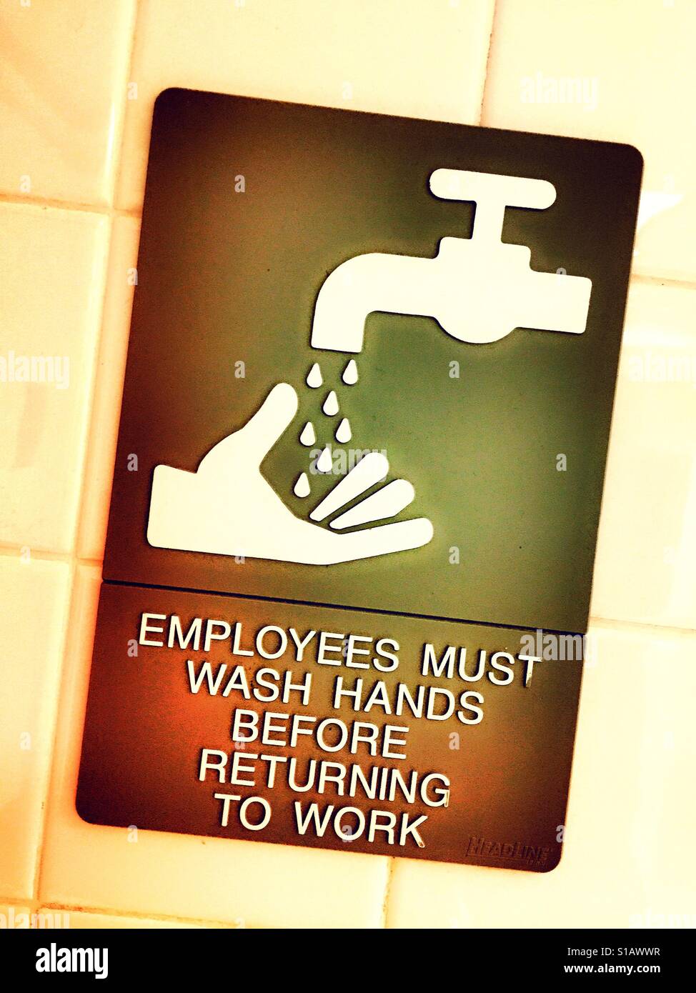 Employees must wash hands after using bathroom sign, USA Stock Photo