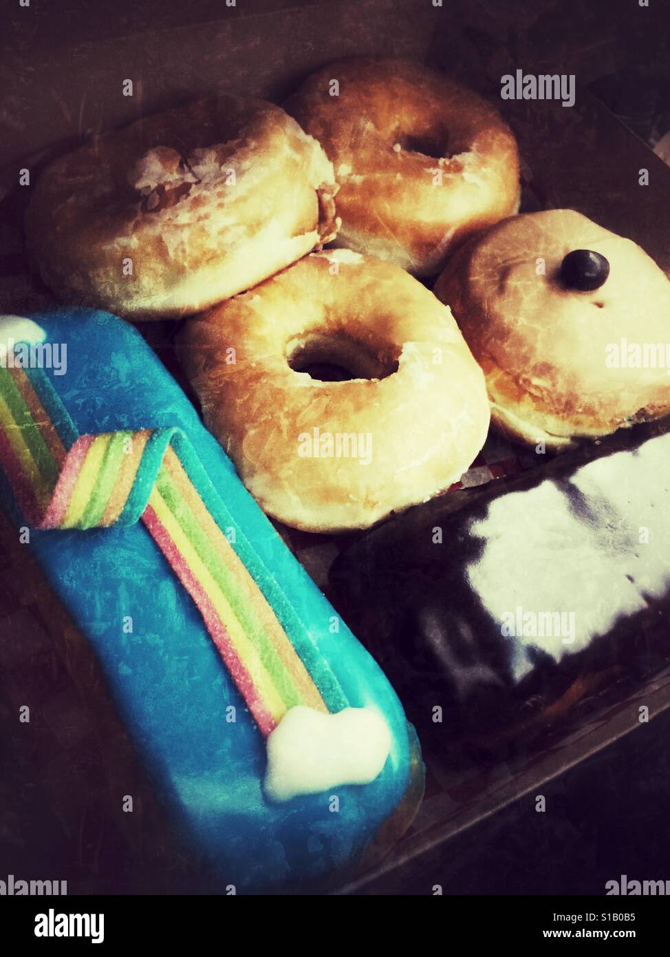 Assortment of doughnuts in a box. - Smartphone Captured Stock Image