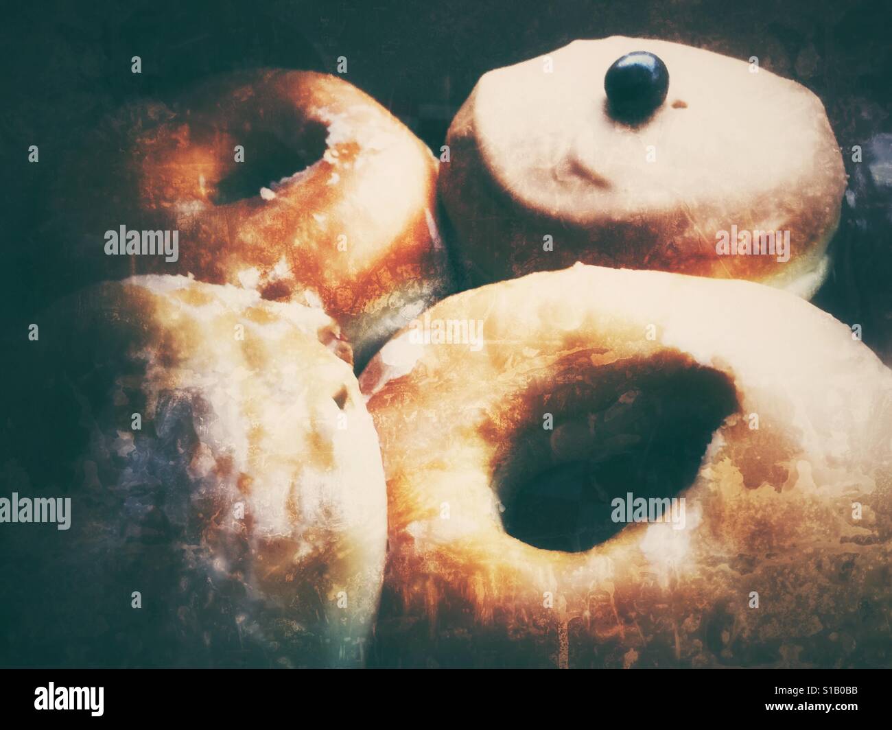 Assortment of glazed doughnuts. Vignette edit. Stock Photo