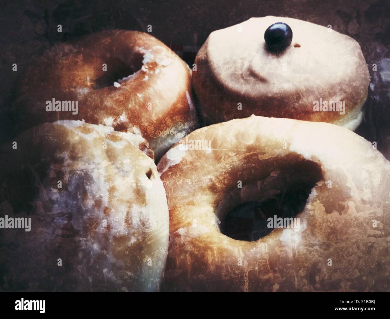 Assortment of glazed doughnuts. Distressed edit. - Smartphone Captured Stock Image