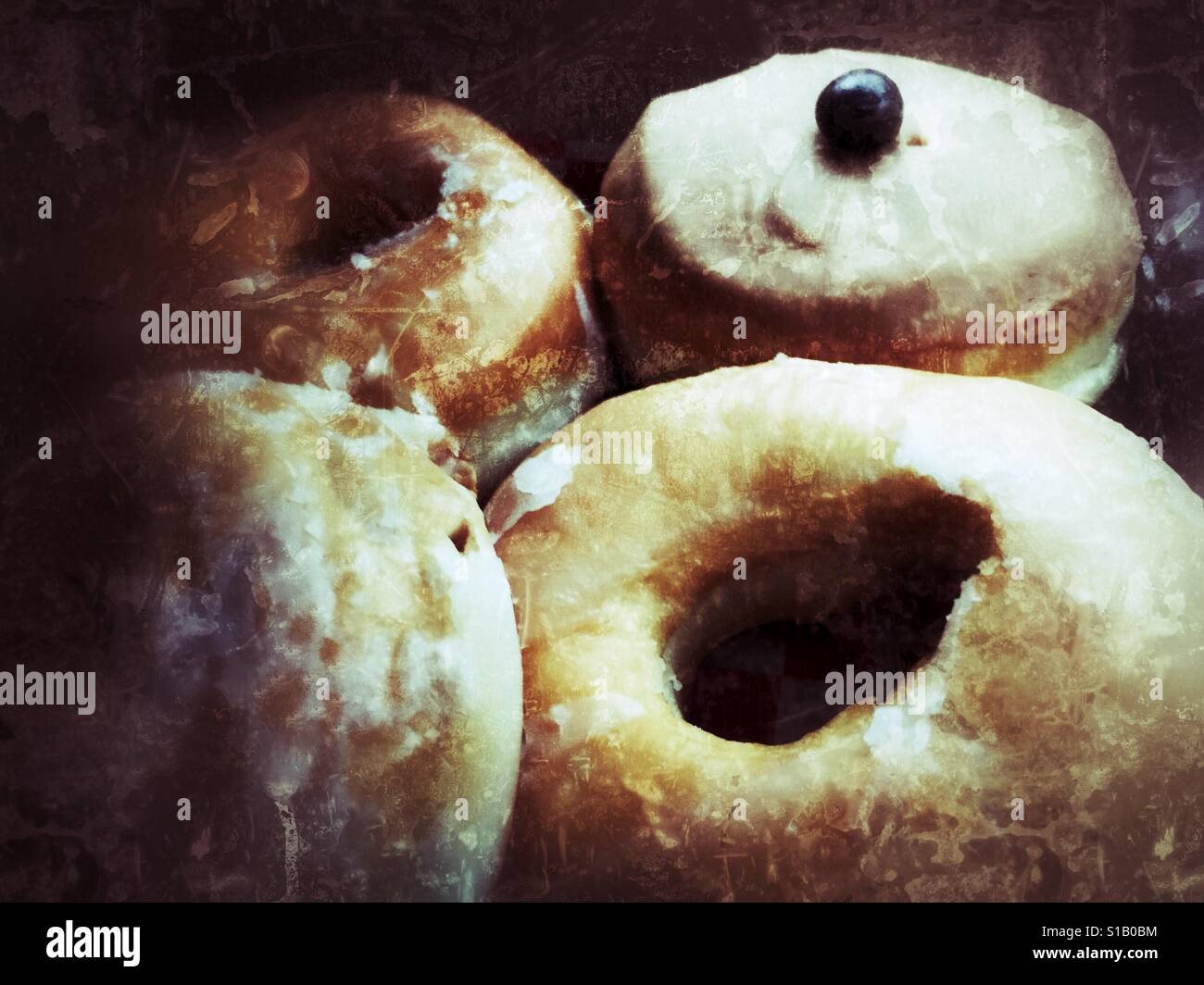 Assortment of sugary glazed doughnuts. Grunge edit. - Smartphone Captured Stock Image