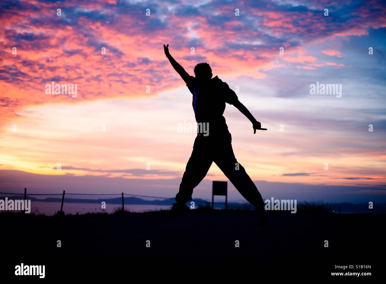 Jump shot at sunset Stock Photo