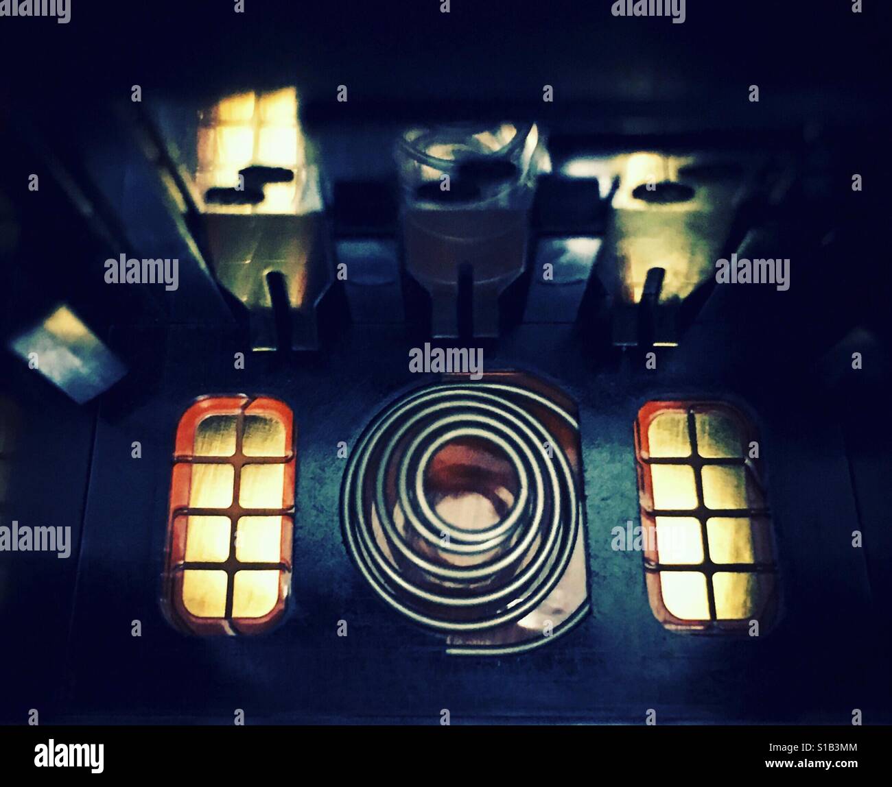 The interior of a battery compartment of a DSLR camera - Smartphone Captured Stock Image