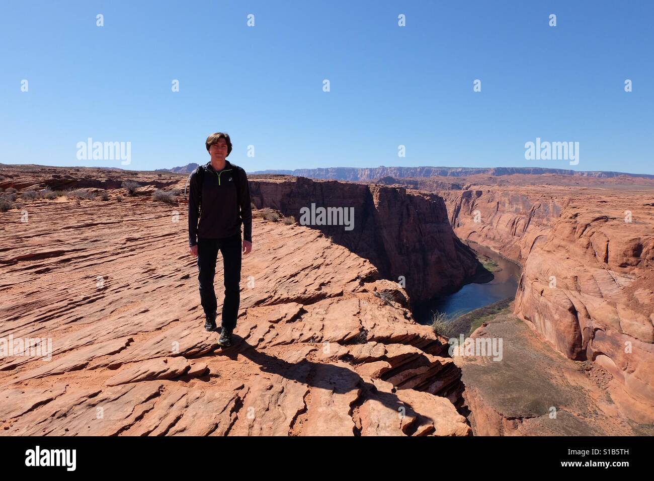 Man at horseshoe bend - Smartphone Captured Stock Image