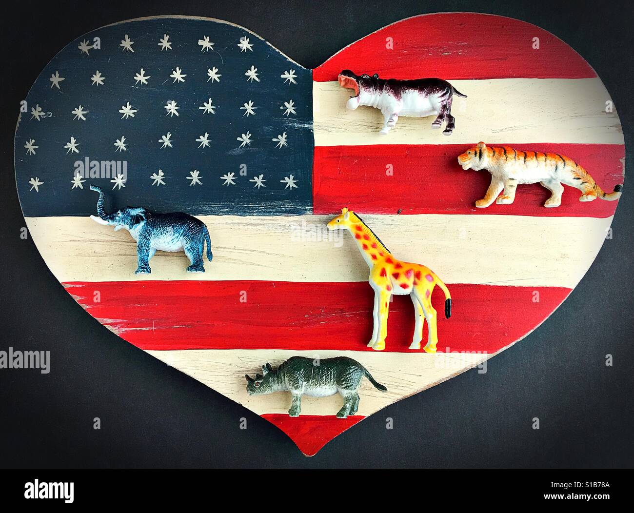 Wild exotic animals on a heart shaped American flag. Stock Photo