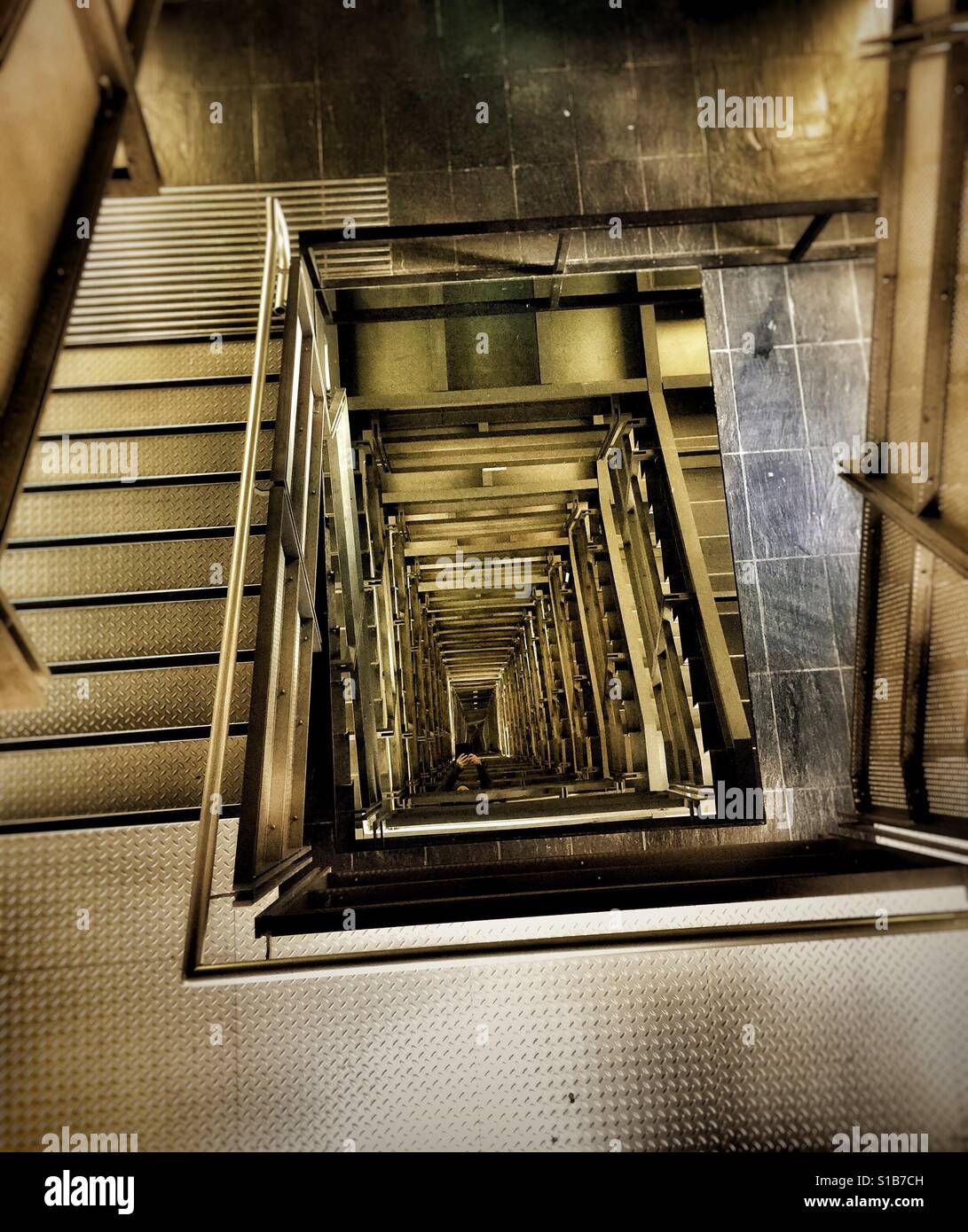 The Illusion a mirror at the bottom and one at the top give an illusion of never ending stairs in the Baltic in Gateshead, Tyne and Wear Stock Photo