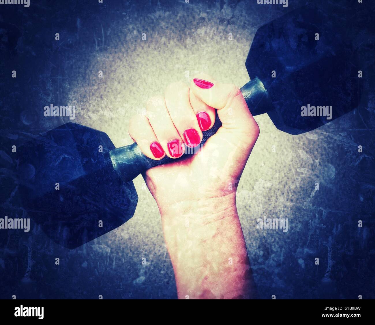 Close up of woman's hand gripping an eight pound dumbbell. Bright centre, vignette edit. - Smartphone Captured Stock Image