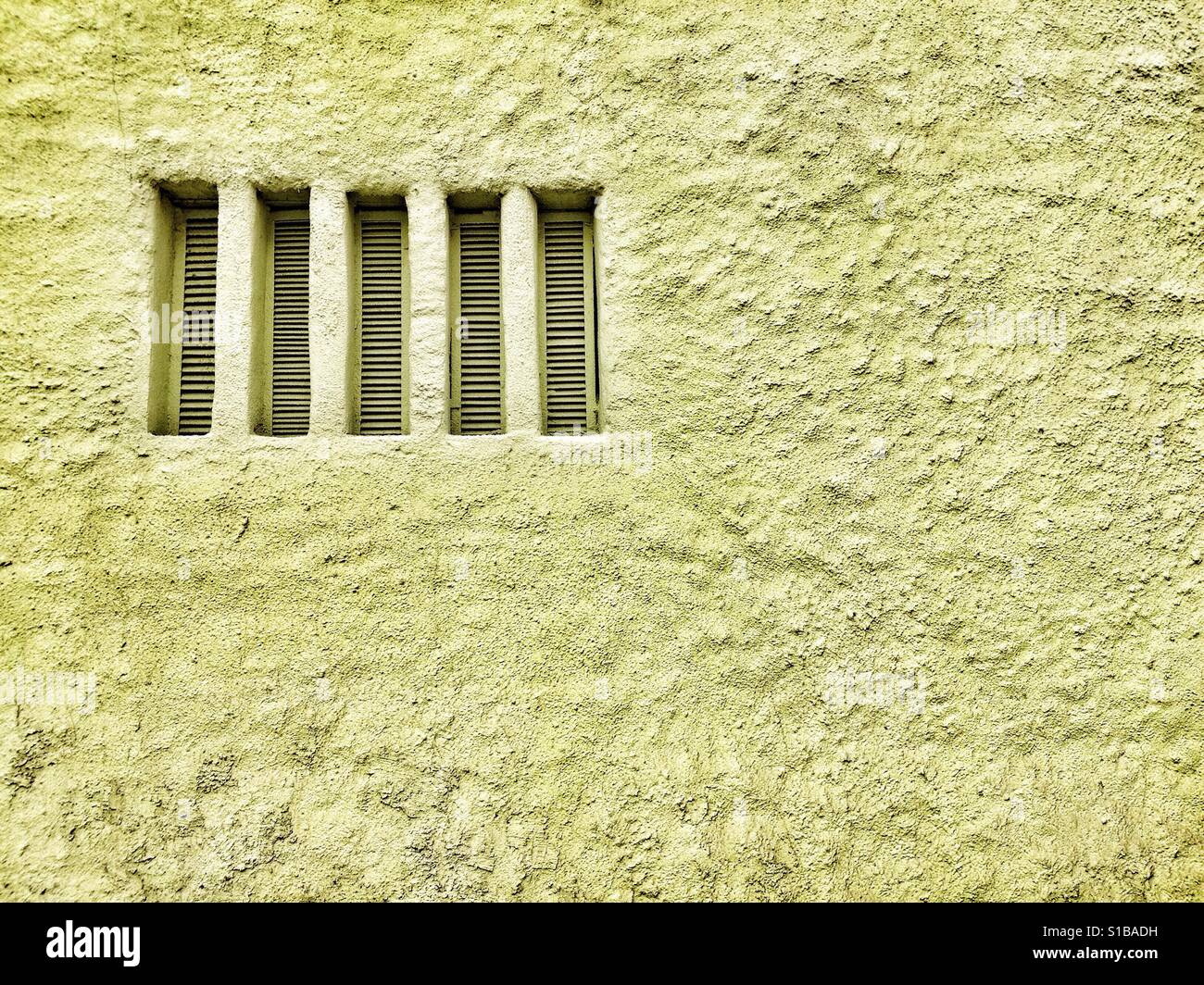 A plaster wall with vents. Abstract minimal picture. - Smartphone Captured Stock Image