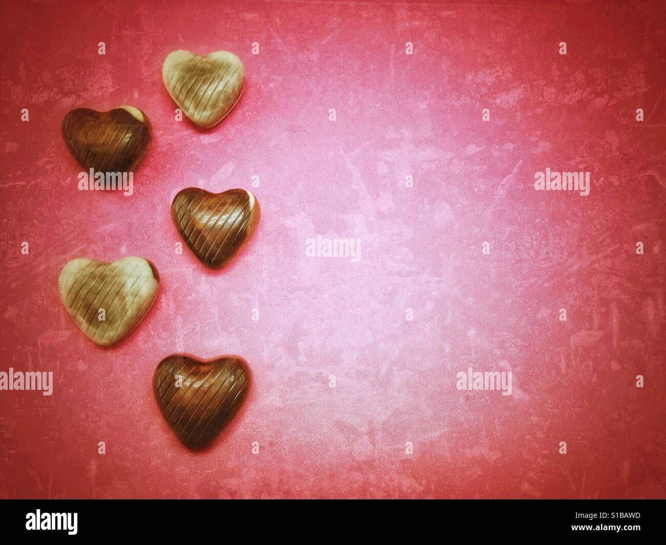 Red background with heart shaped candies - Smartphone Captured Stock Image