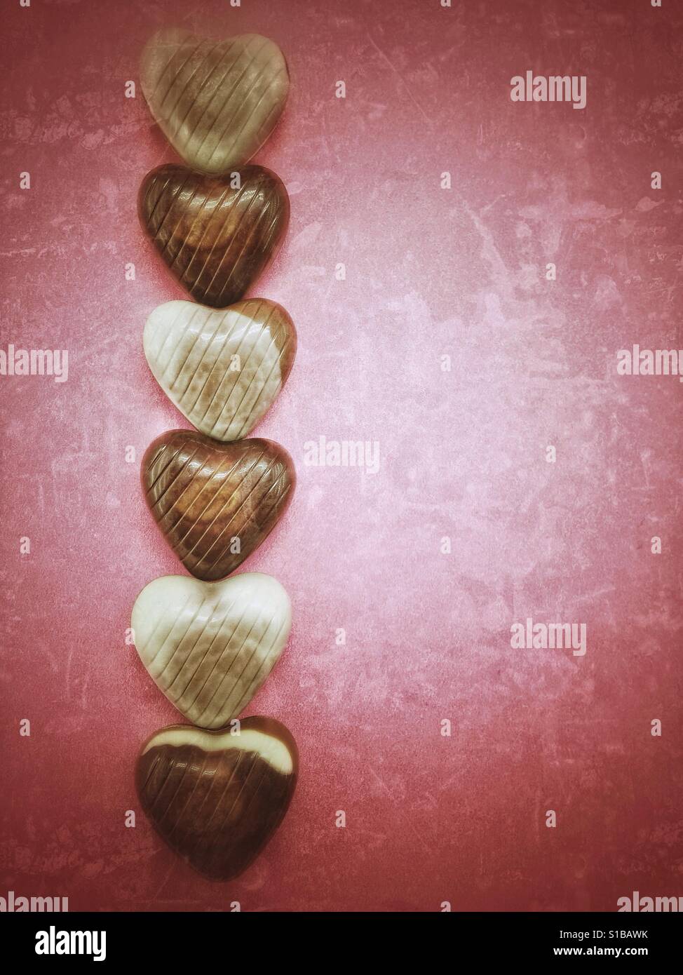 Chocolate candies in a row - Smartphone Captured Stock Image