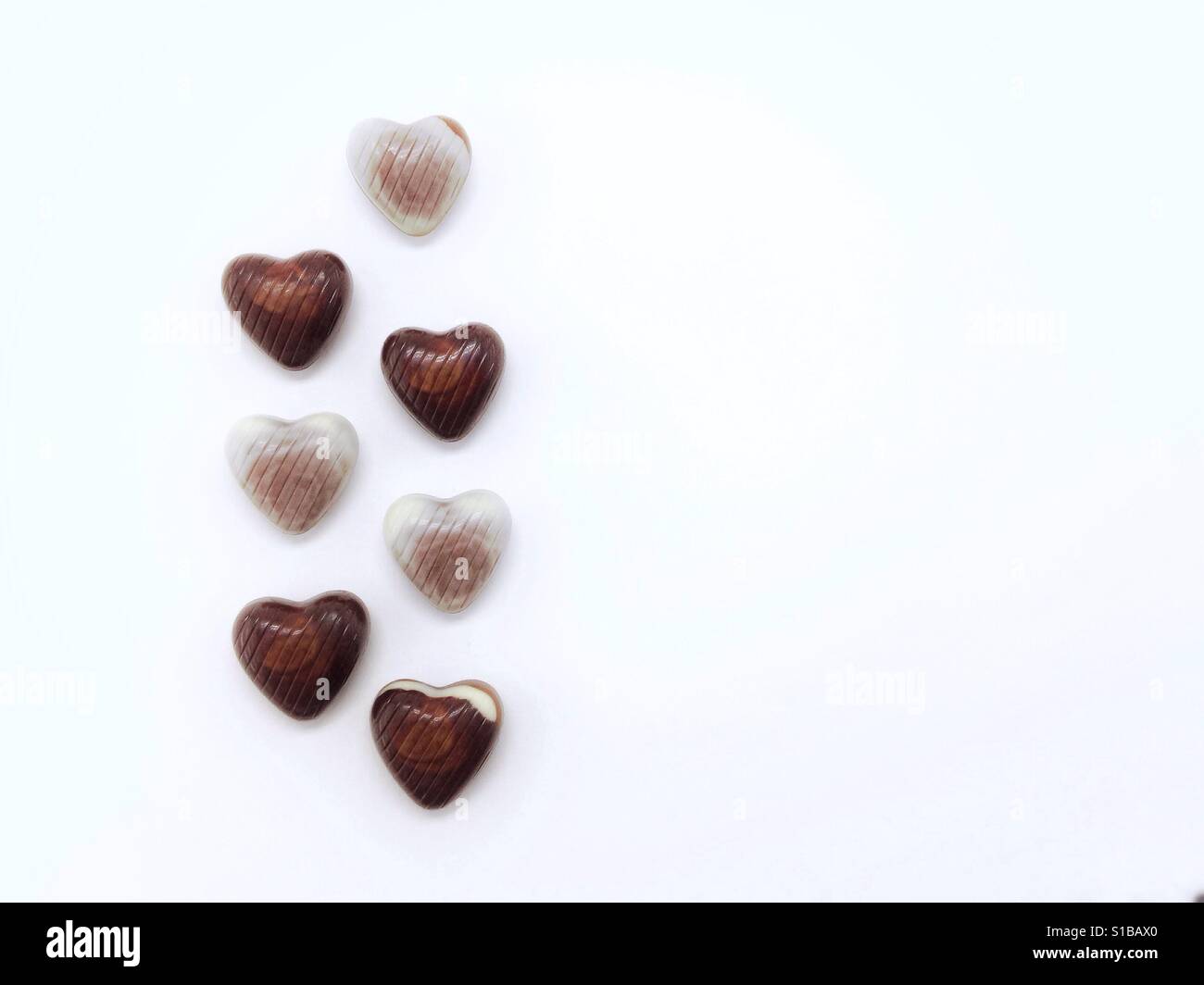 white background with chocolate candies - Smartphone Captured Stock Image