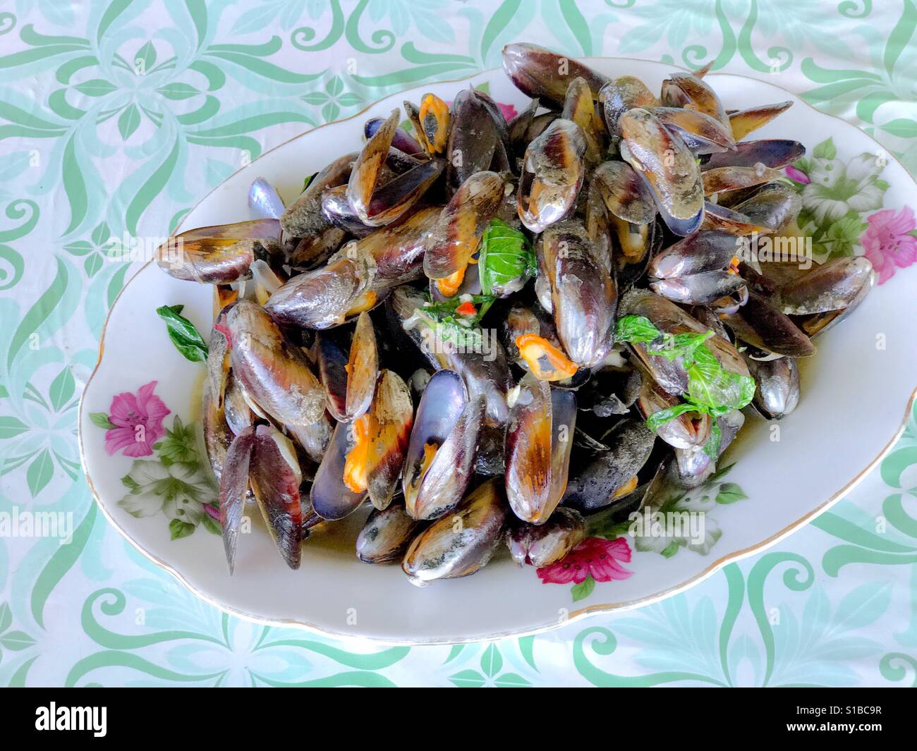 Stir fried horse mussels with basil leaves Stock Photo Alamy