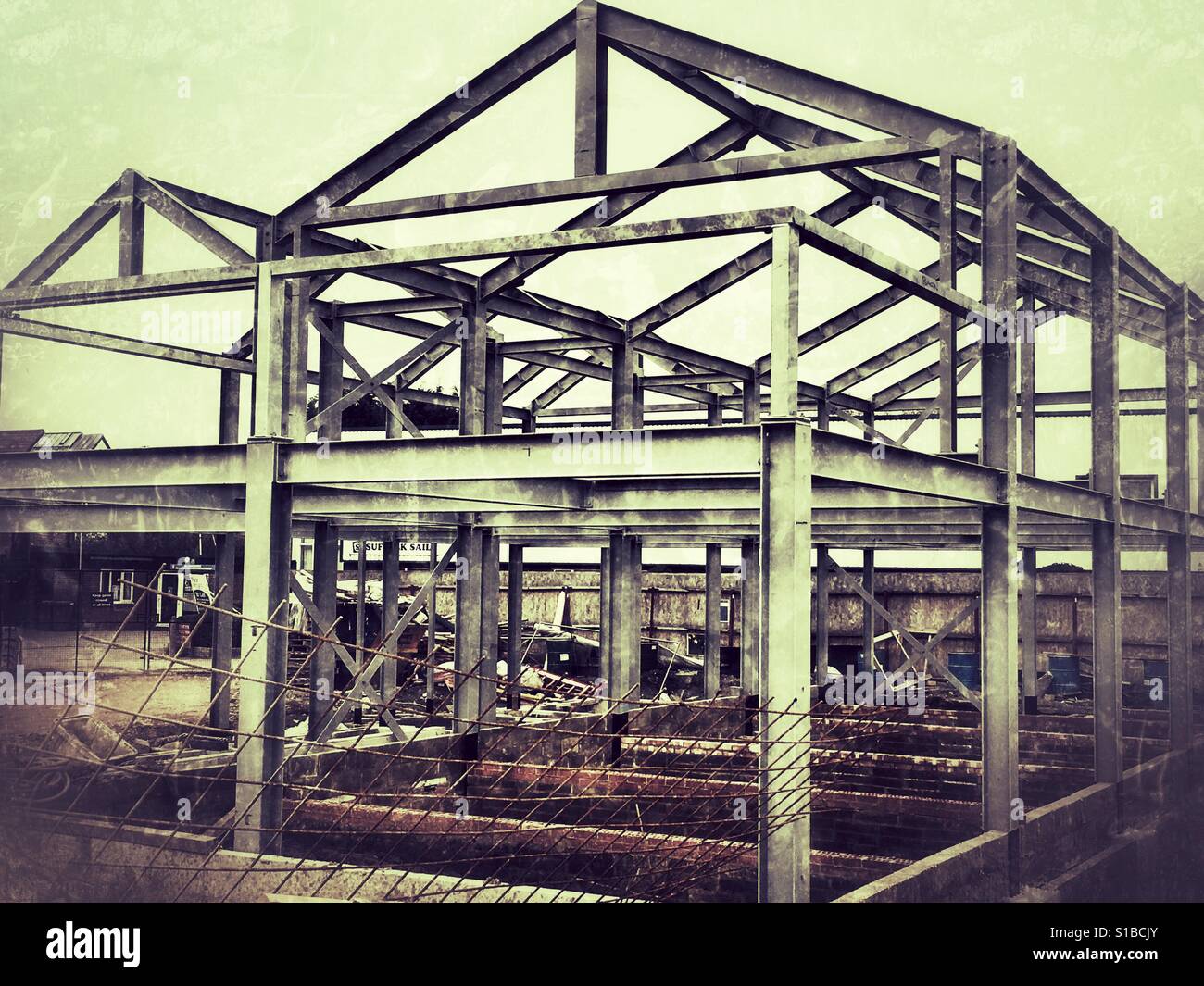 Steel framed building under construction at the Whisstocks riverside development, Woodbridge, Suffolk, UK. - Smartphone Captured Stock Image