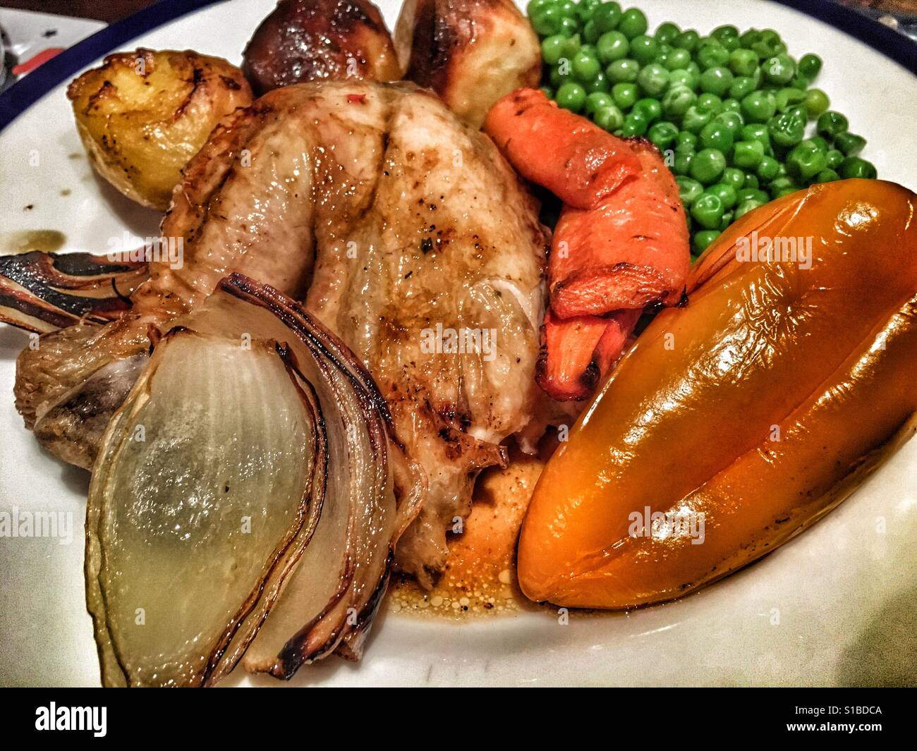 Roast chicken and vegetables on a plate - Smartphone Captured Stock Image
