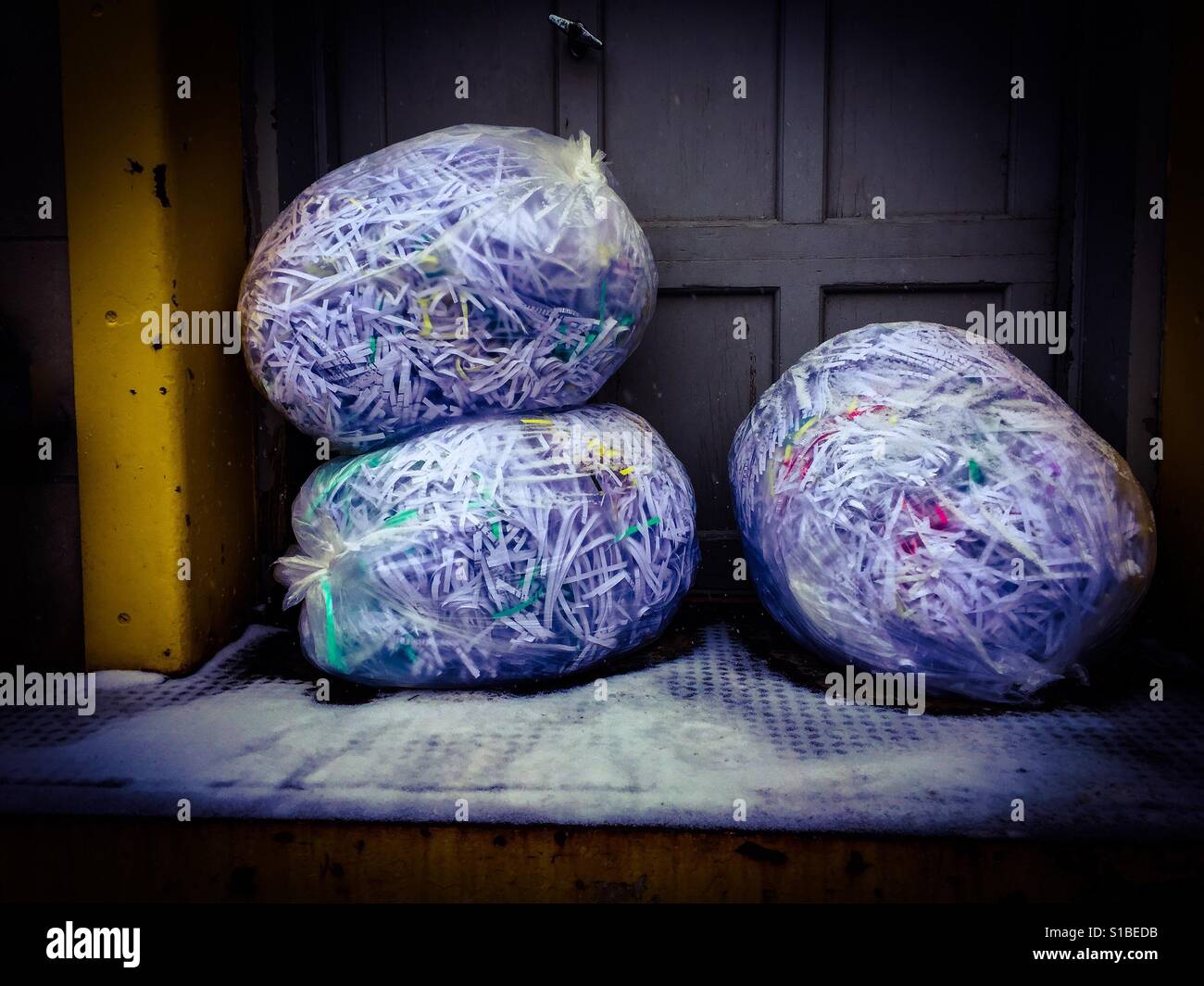 Shredded 2. Three bags full. Ready for recycling. Loading dock. Pickup soon. - Smartphone Captured Stock Image