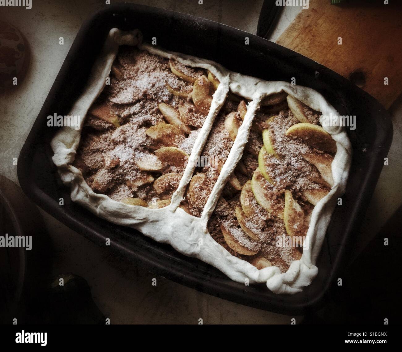 Open homemade pear pie ready for baking in the metal form - Smartphone Captured Stock Image