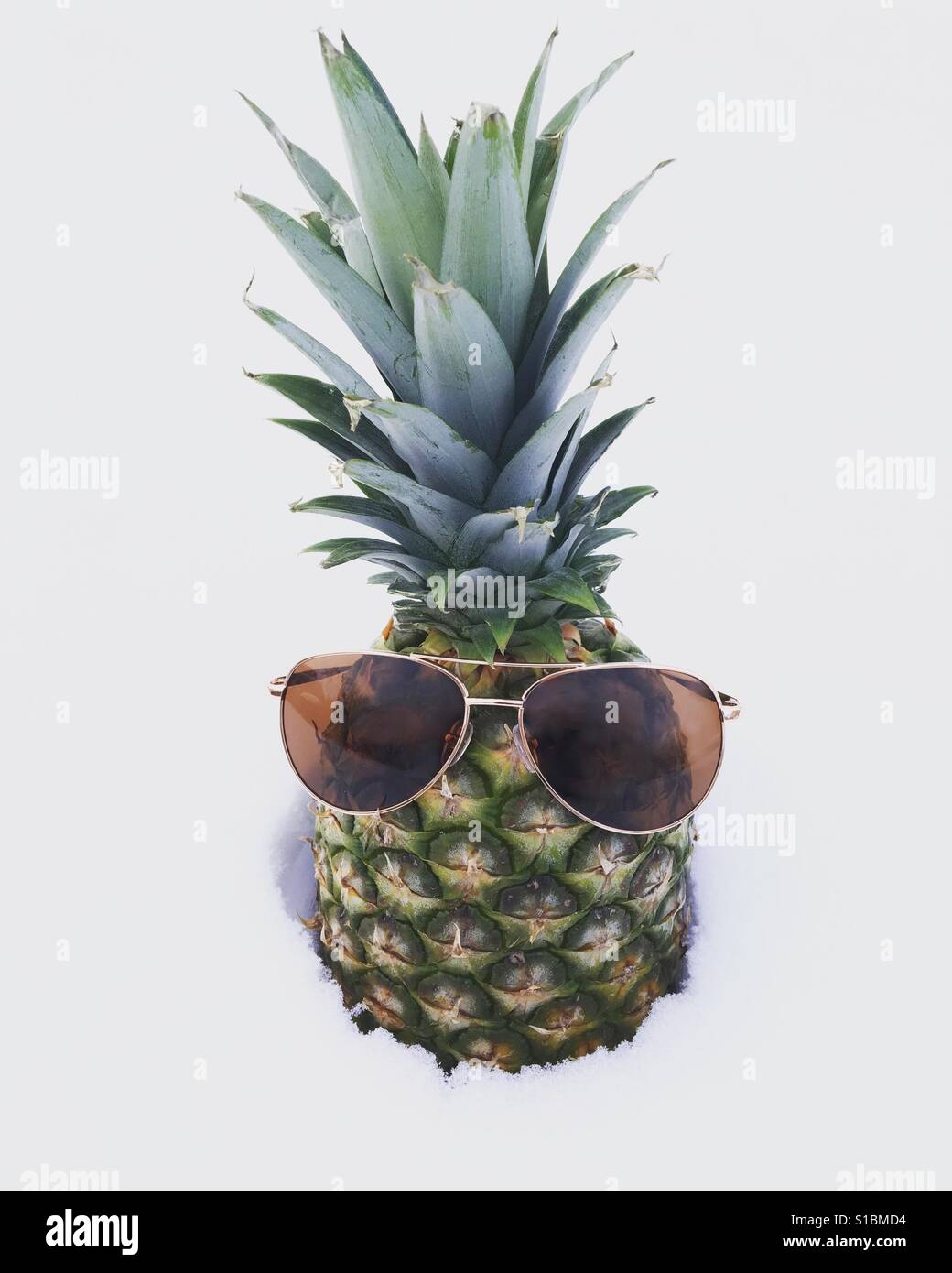 Sunglasses on pineapple in snow - Smartphone Captured Stock Image