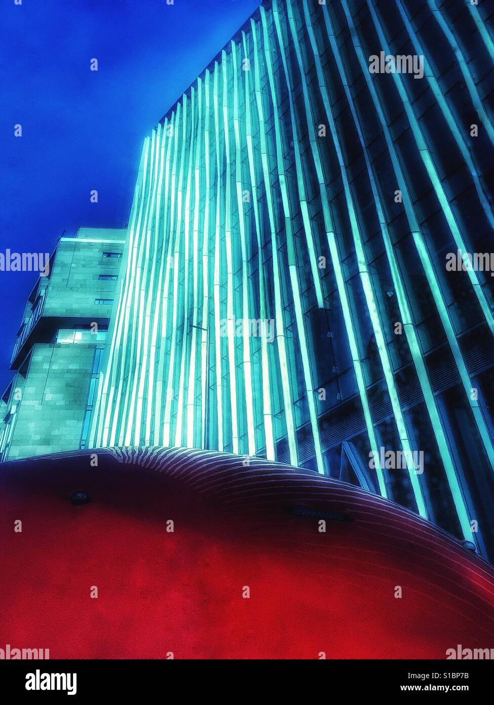 Buildings reflected in a London bus. - Smartphone Captured Stock Image