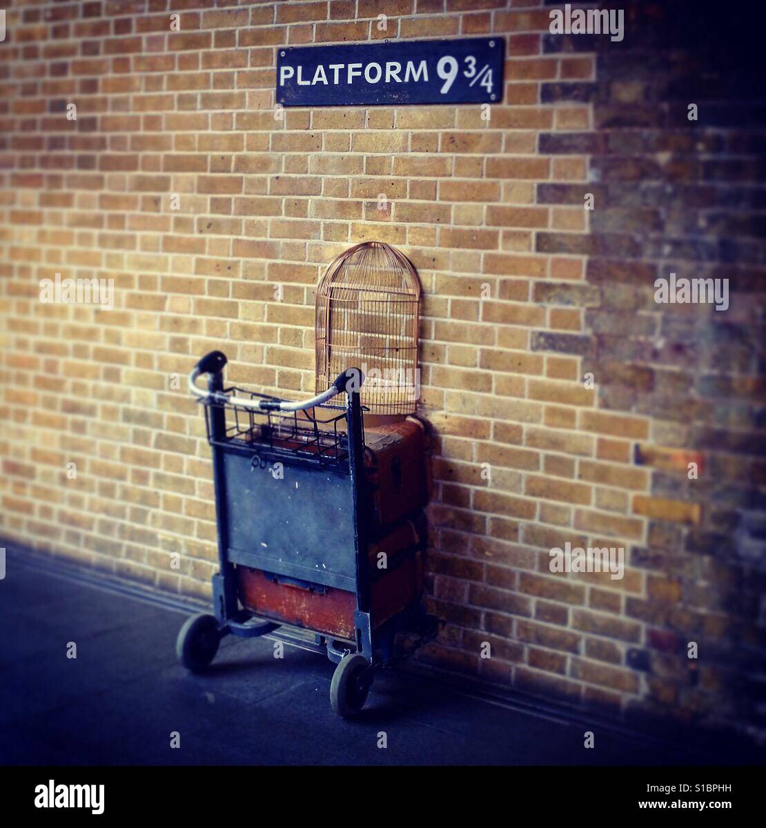 Harry Potter platform 9 & 3/4 at London Kings Cross train station. Stock Photo