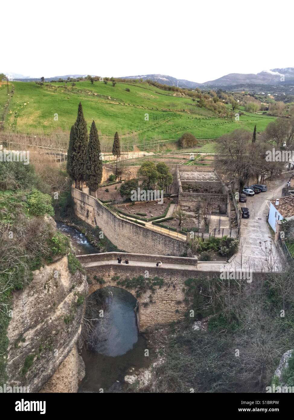 View of the Arab baths from the top of the gorge in Ronda, Andalucia, Southern Spain - Smartphone Captured Stock Image