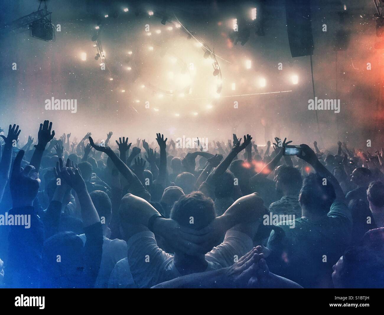 An excited crowd at a music concert - Smartphone Captured Stock Image