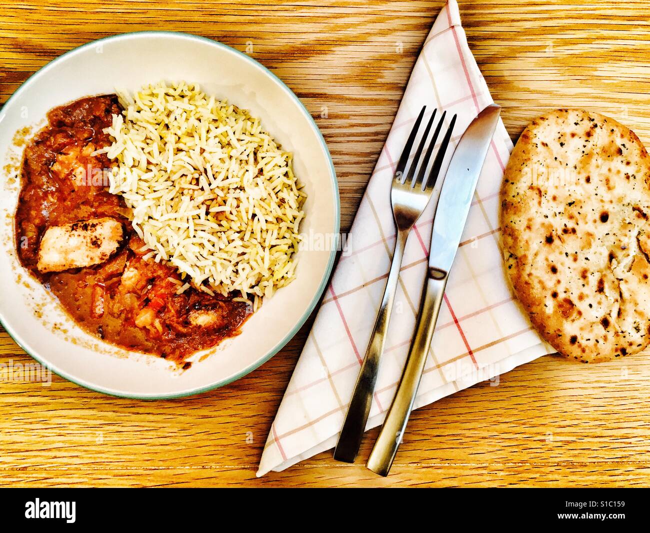 Chicken Jalfrezi & Pilau rice with Naan bread Stock Photo