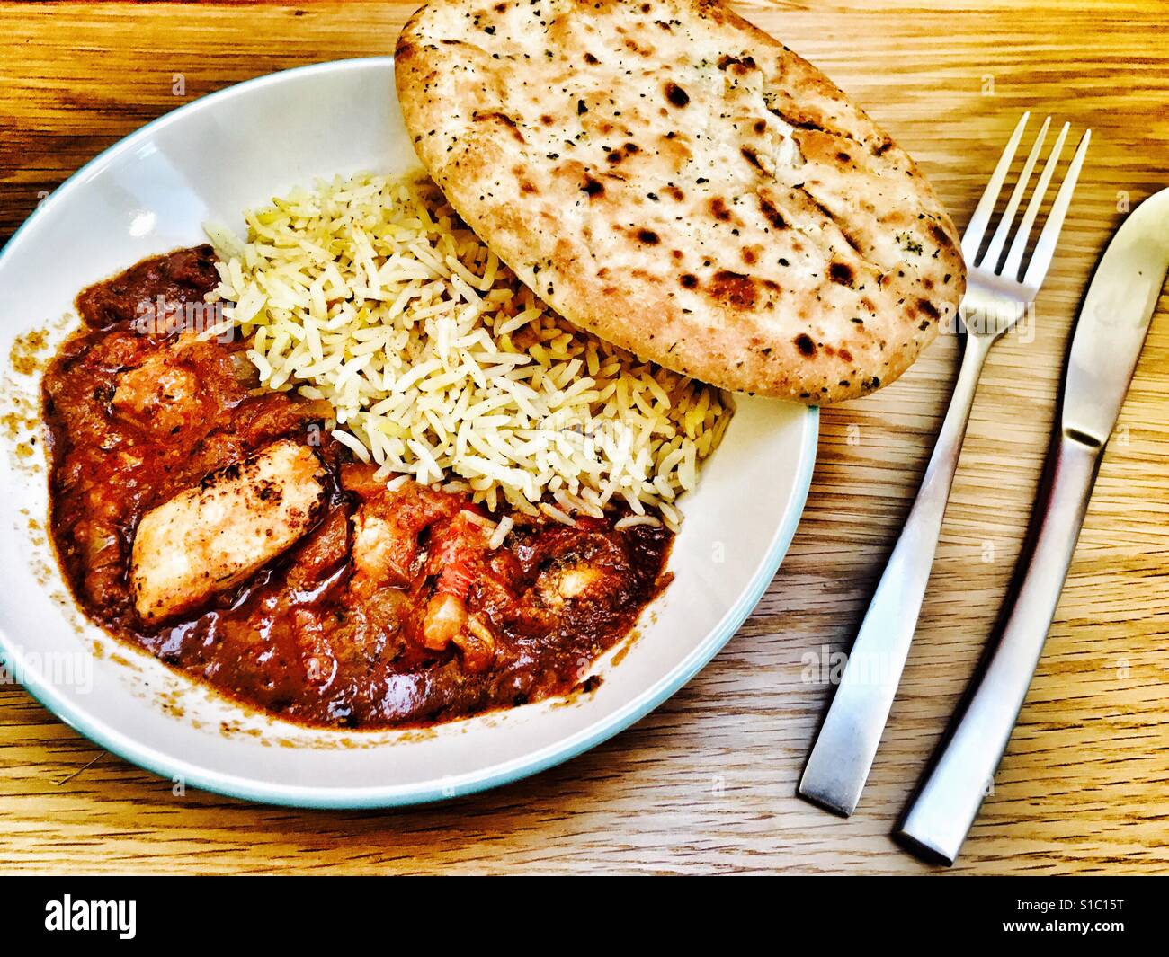 Chicken Jalfrezi & pilau rice with Naan bread Stock Photo