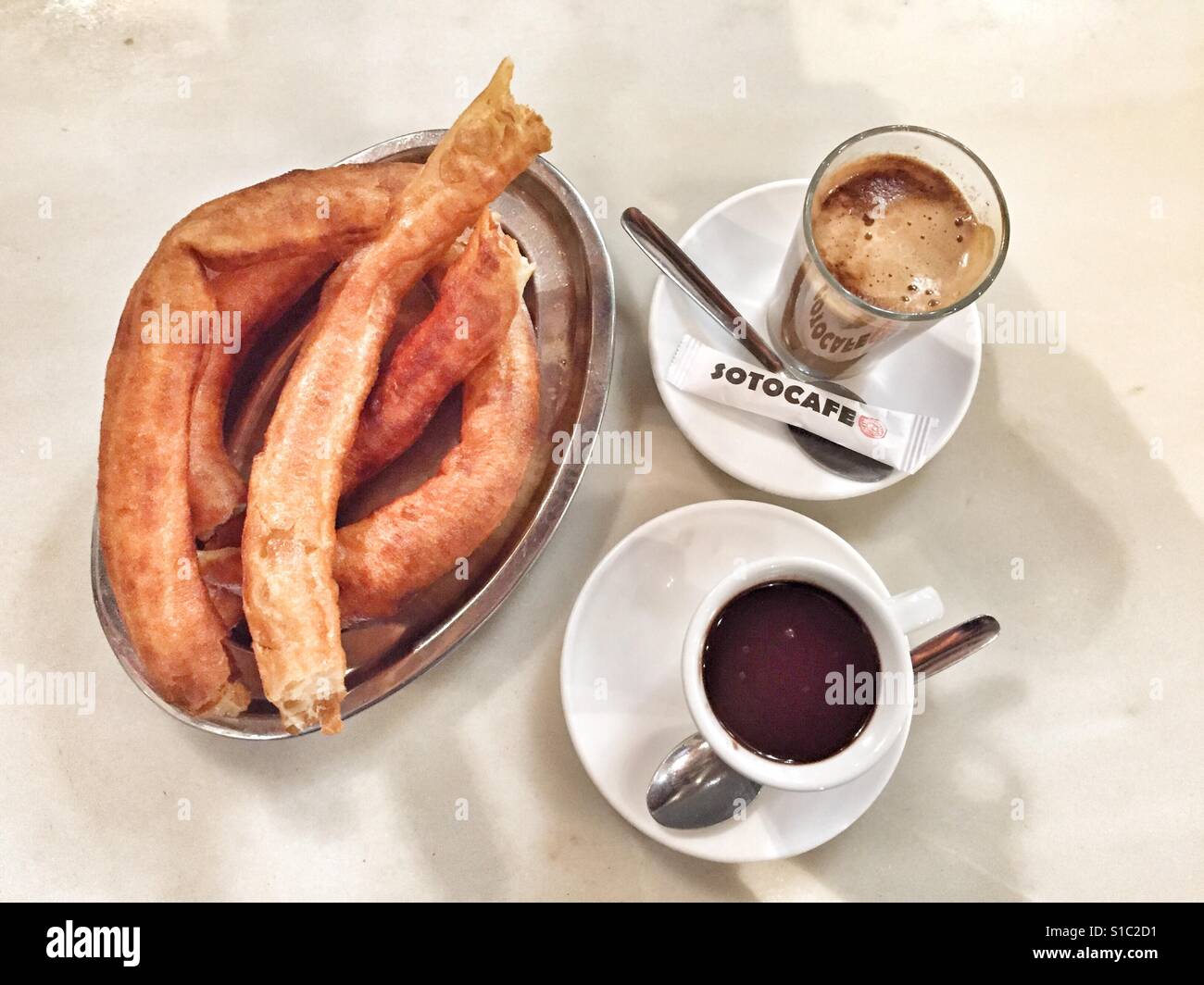 Chocolate, churros, cafe con leche. Andalucian speciality food! Stock Photo