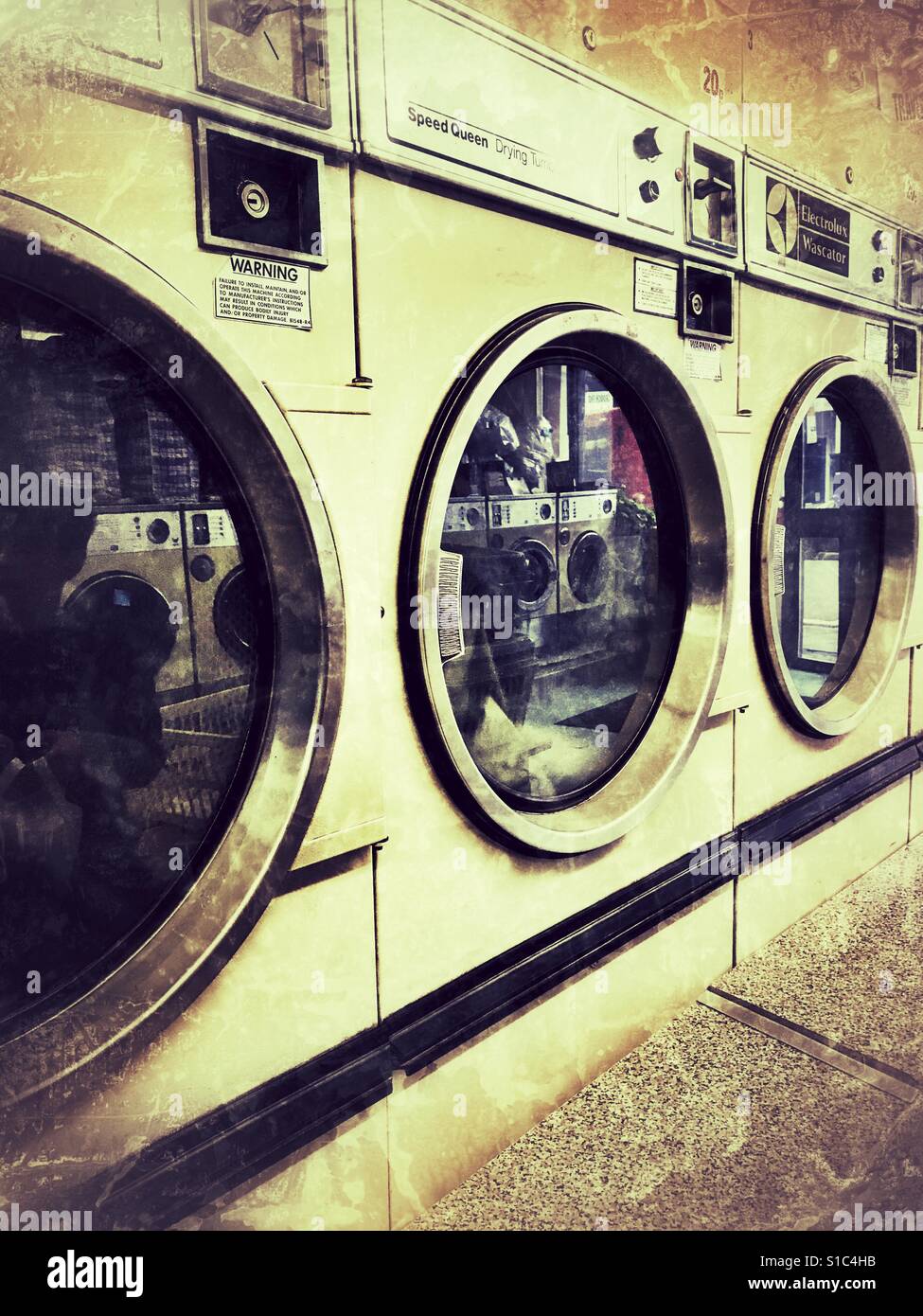 A row of dryers in a Laundrette Stock Photo Alamy