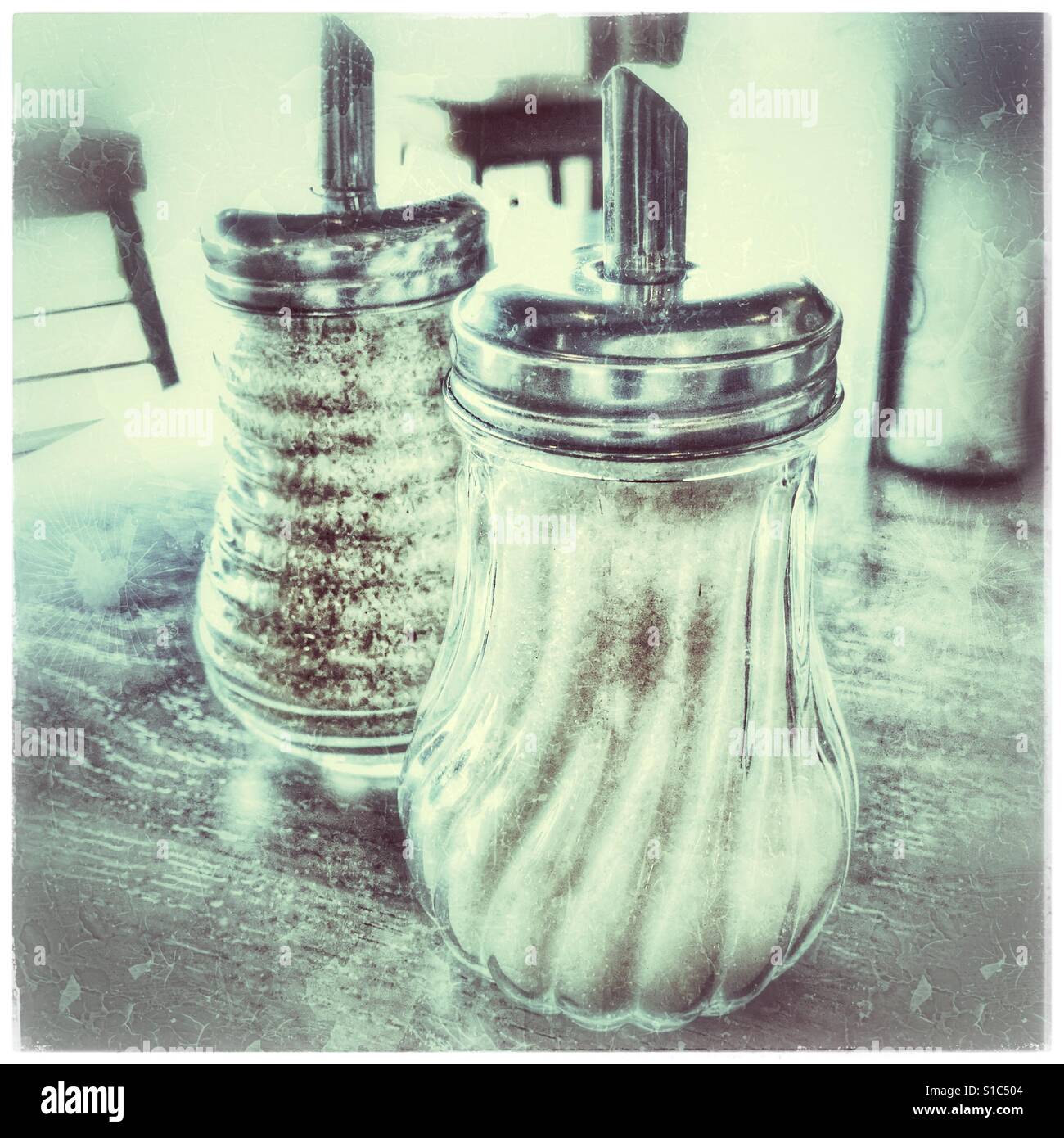 White and brown sugar shakers in restaurant table Stock Photo Alamy