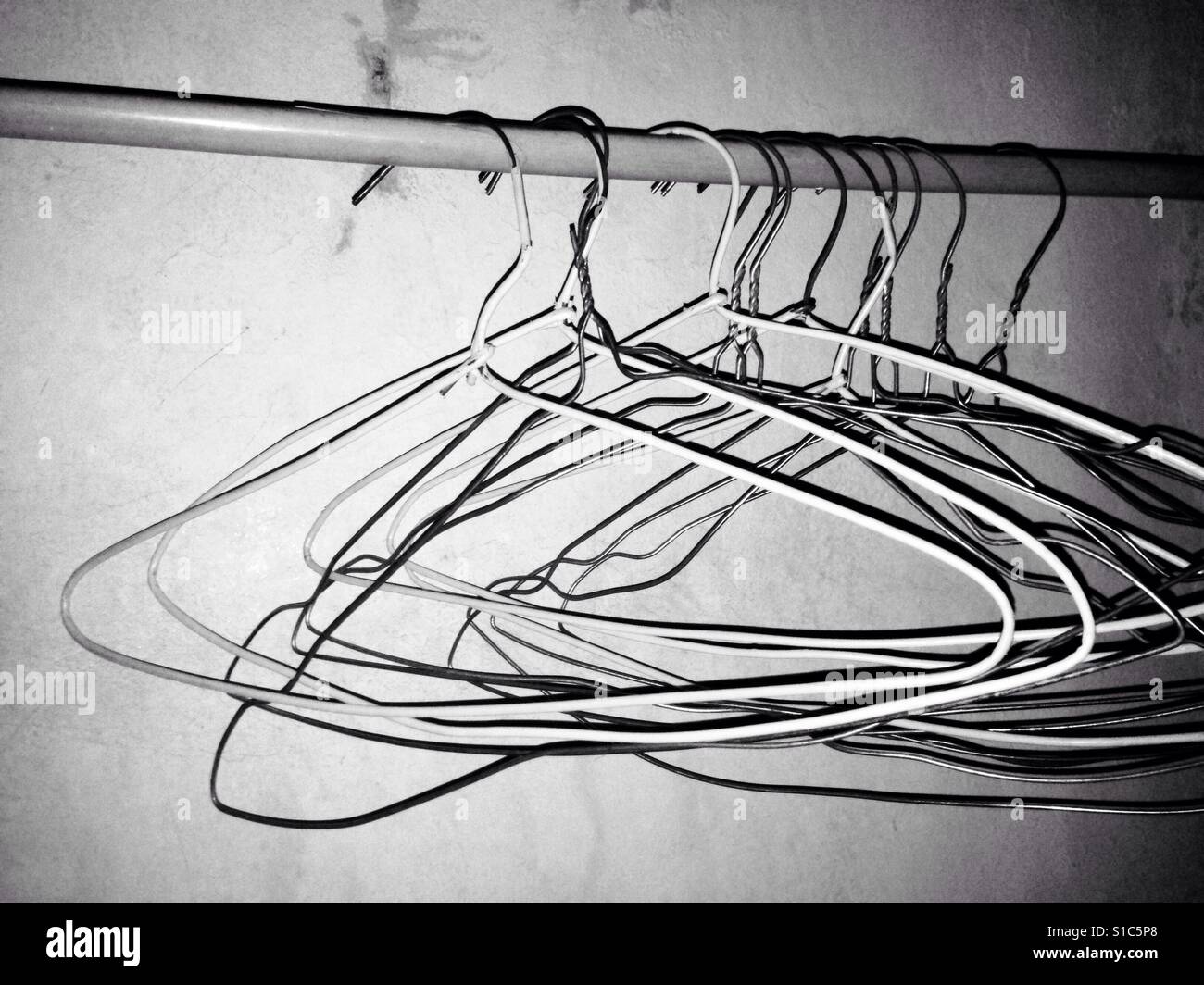 Old Hangers on Hangers Stand - Black and White Stock Photo