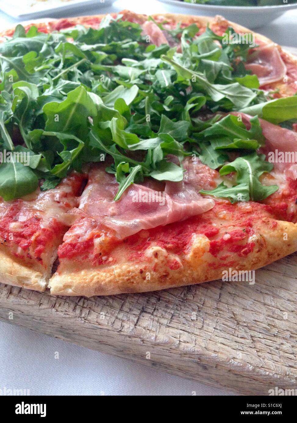 Italian pizza with Parma ham and arugula Stock Photo Alamy
