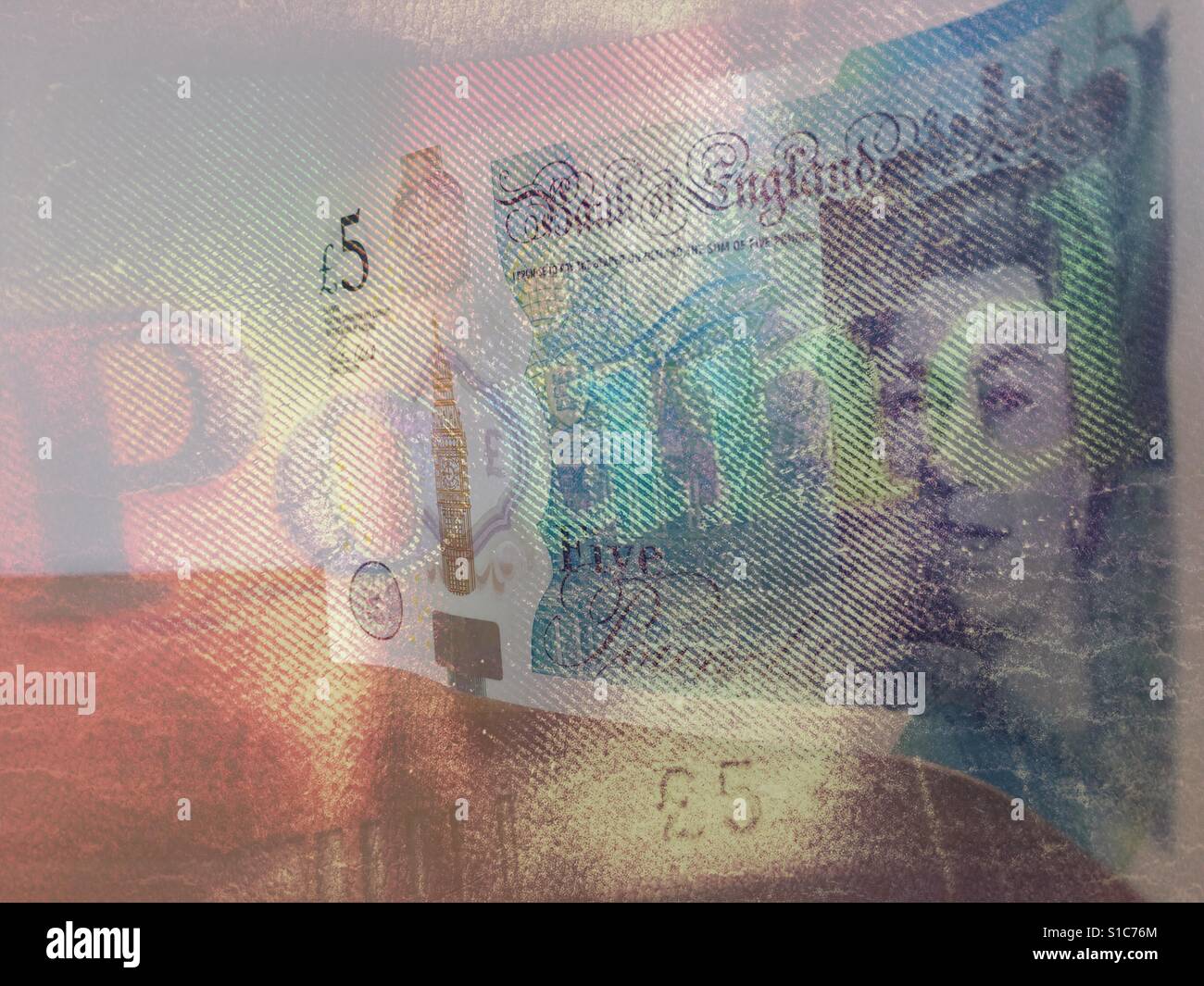 Double exposure. Macro of the holographic word Pound on a £5 note, with a £5 banknote standing on its edge. - Smartphone Captured Stock Image