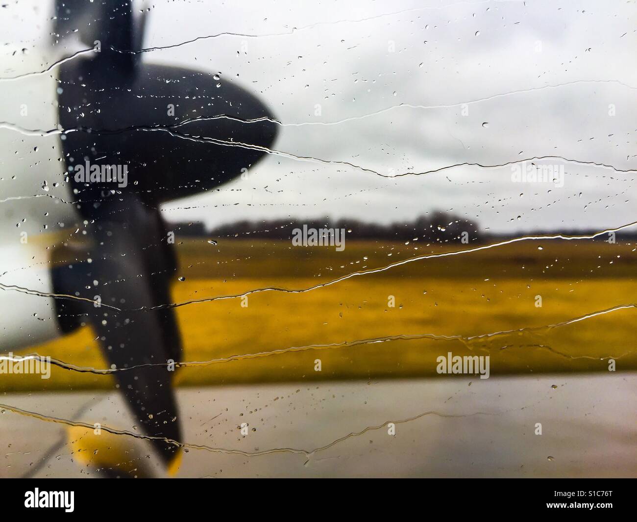 Taking off in rain - Smartphone Captured Stock Image