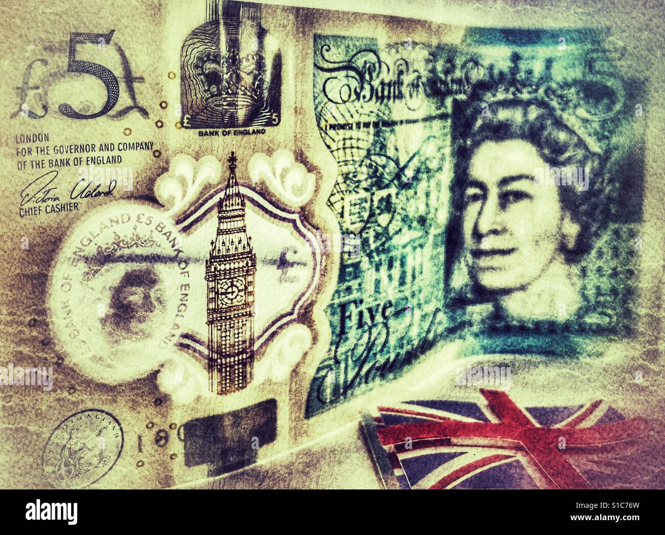 English £5 banknote standing on its edge and a Union Jack flag - Smartphone Captured Stock Image