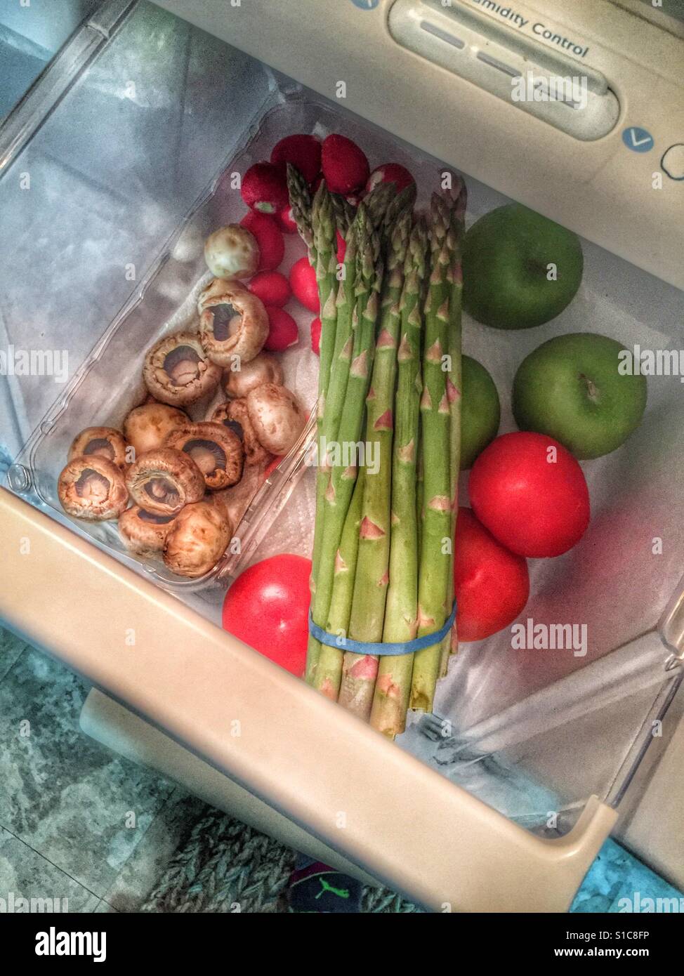 Checking the produce drawer in the refrigerator and it's full of fresh