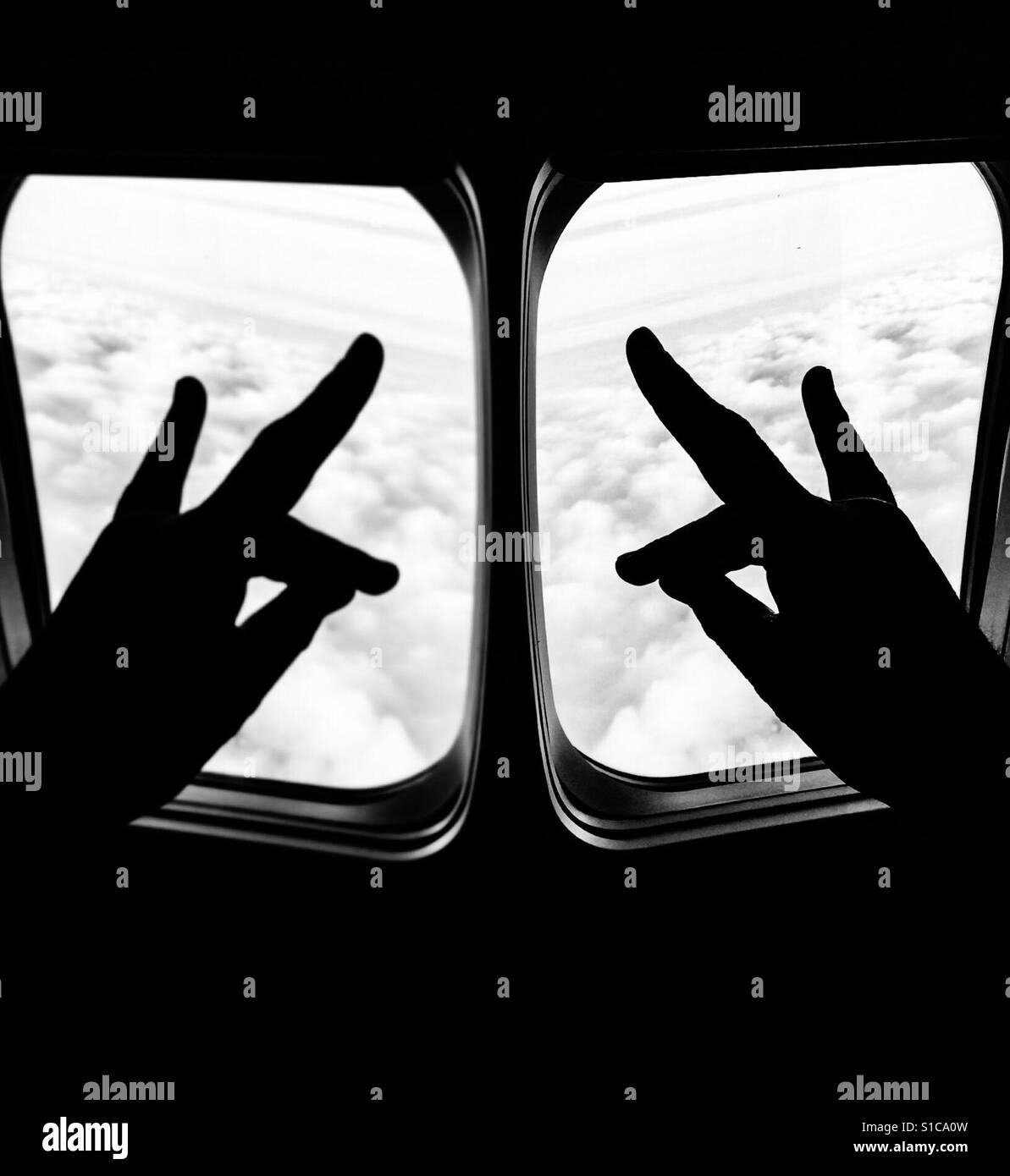 Two windows two hands up in the sky. Magical fingers. Hand art. Pass the time. Copy space. Idler. Both hands now. - Smartphone Captured Stock Image