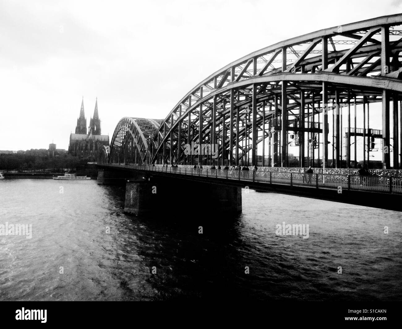 Hohenzollernbrücke Bridge over the Rhine River leading into Cologne old town Stock Photo