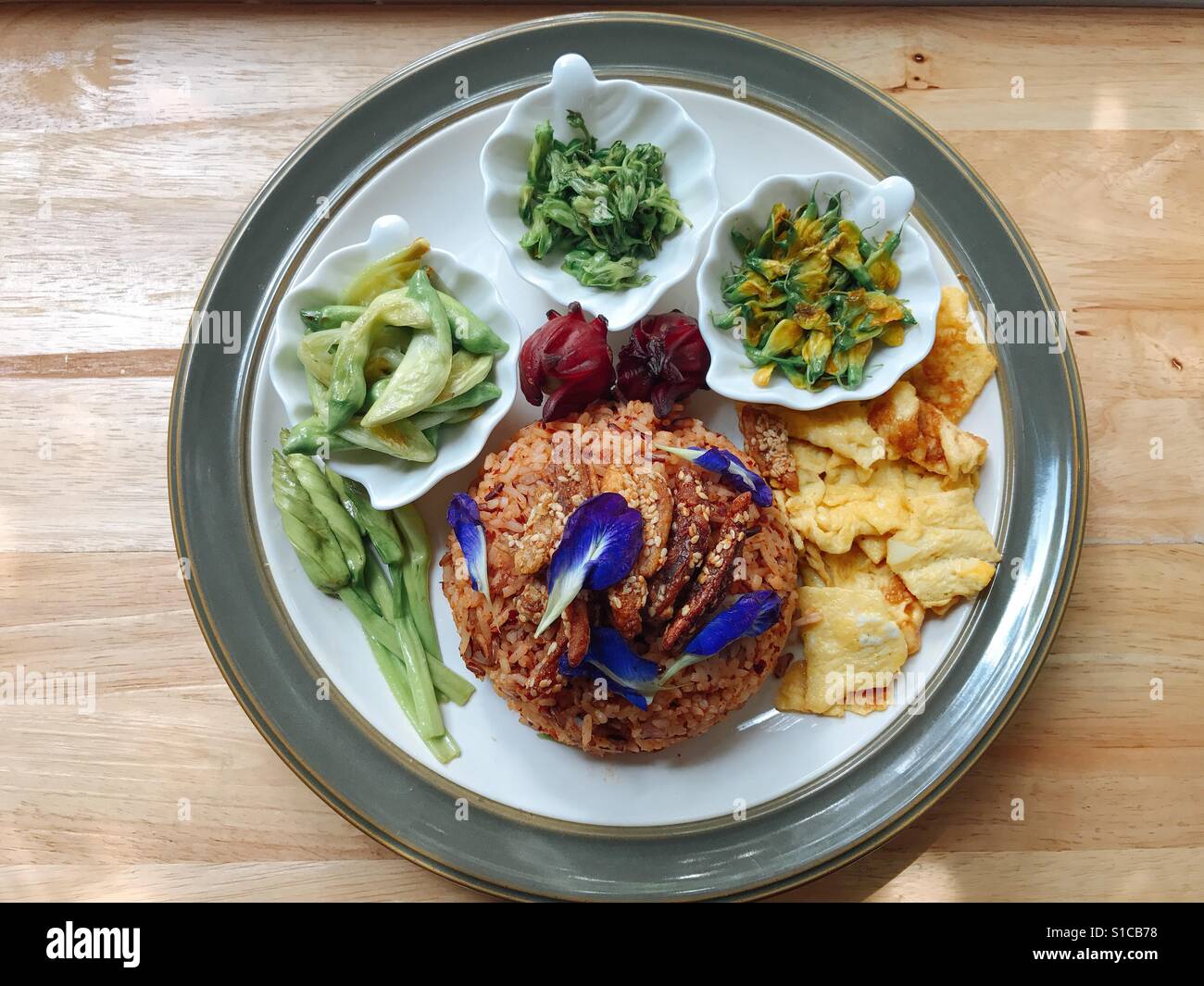 Thai chilli paste fried rice with Thaistyle omelette and edible